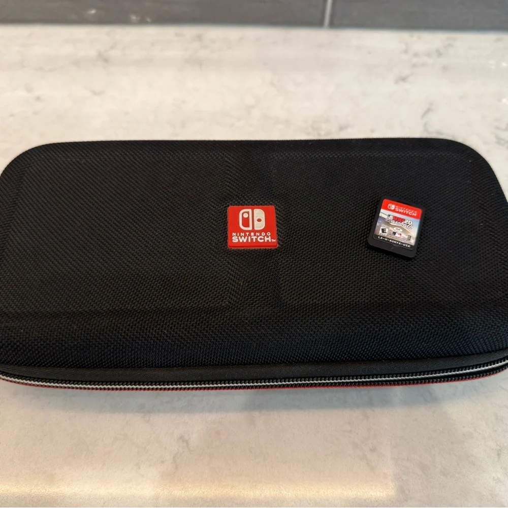 Nintendo Switch Console w/ Game, Case, Dock, and Joy-Cons.